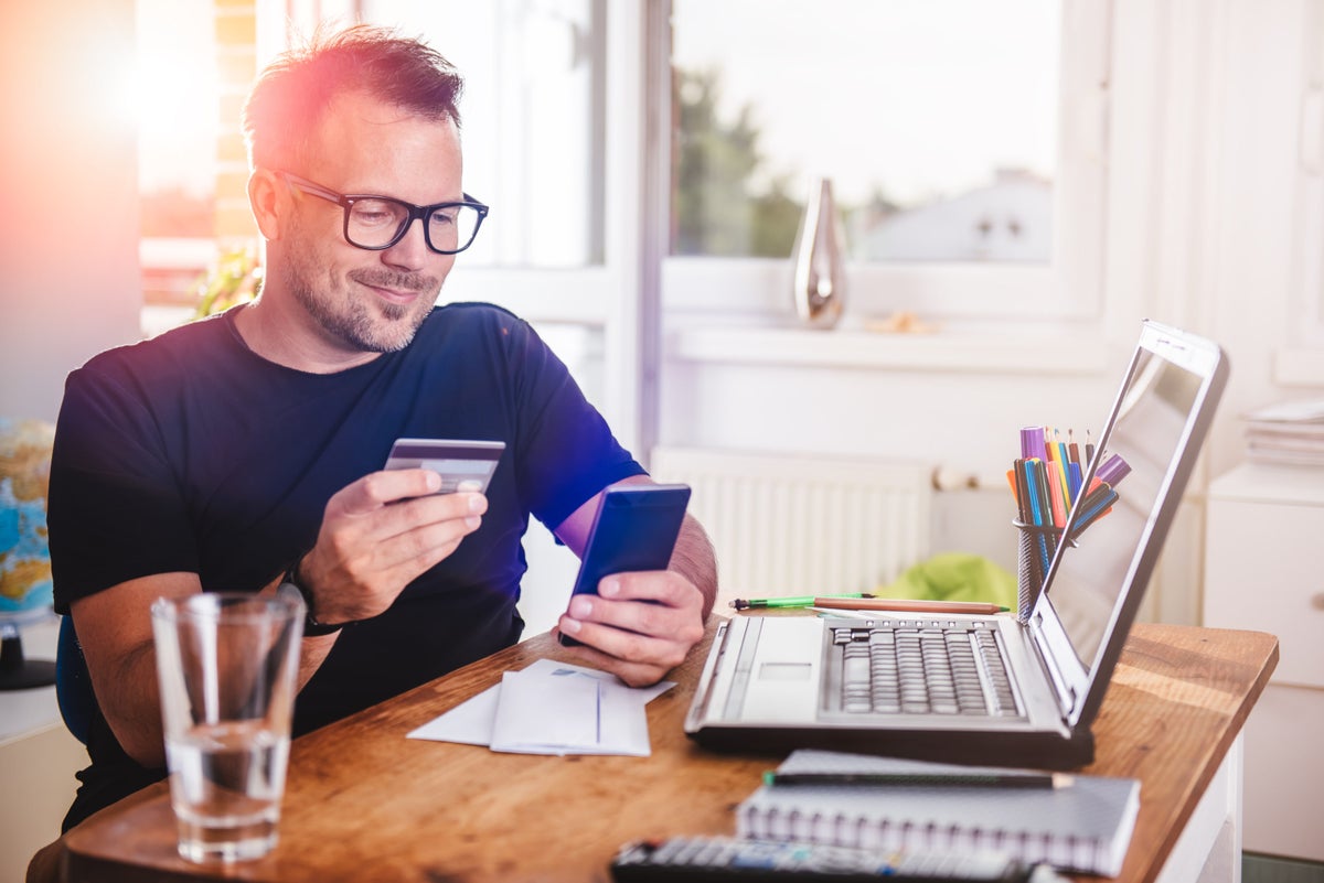Man with credit card and laptop